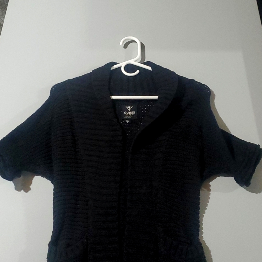 Womens long black, open front guess sweater with pockets.